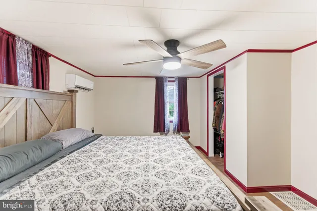 a bathroom with a toilet a sink and a mirror
