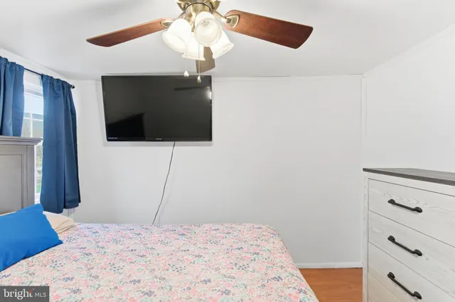 a front view of a house with a garden and entertaining space