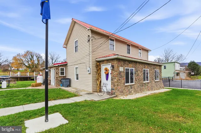a view of a house with swimming pool