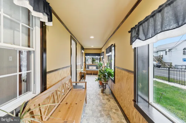a view of entryway with wooden floor