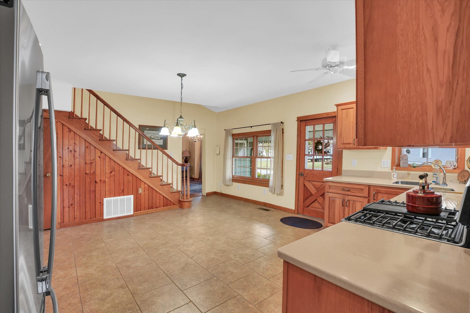 112 North Front Street Sadorus, IL 61872 - Photo 15 of 44 a view of a kitchen with a stove top oven a sink and dishwasher