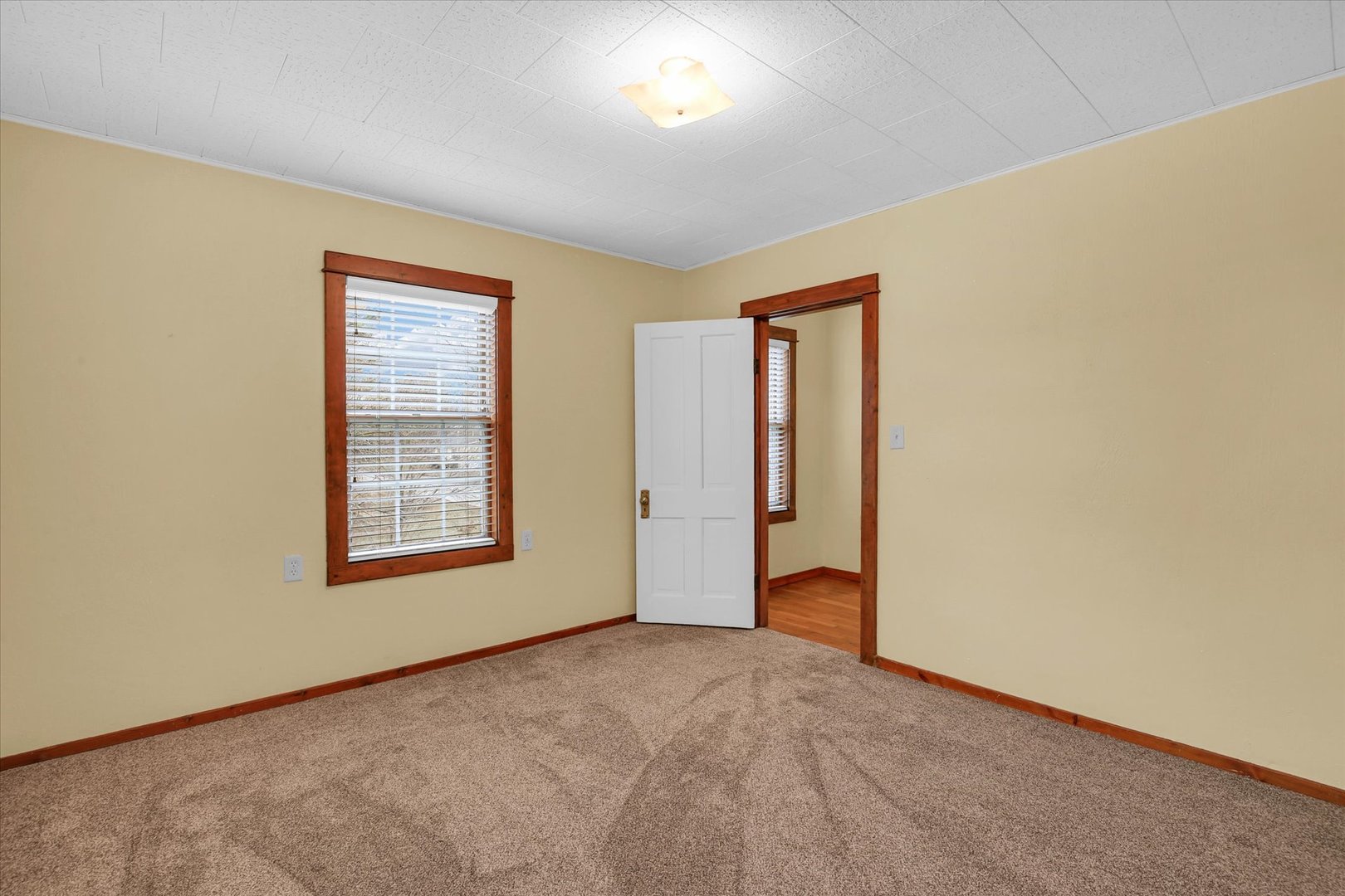 112 North Front Street Sadorus, IL 61872 - Photo 16 of 44 an empty room with windows and closet