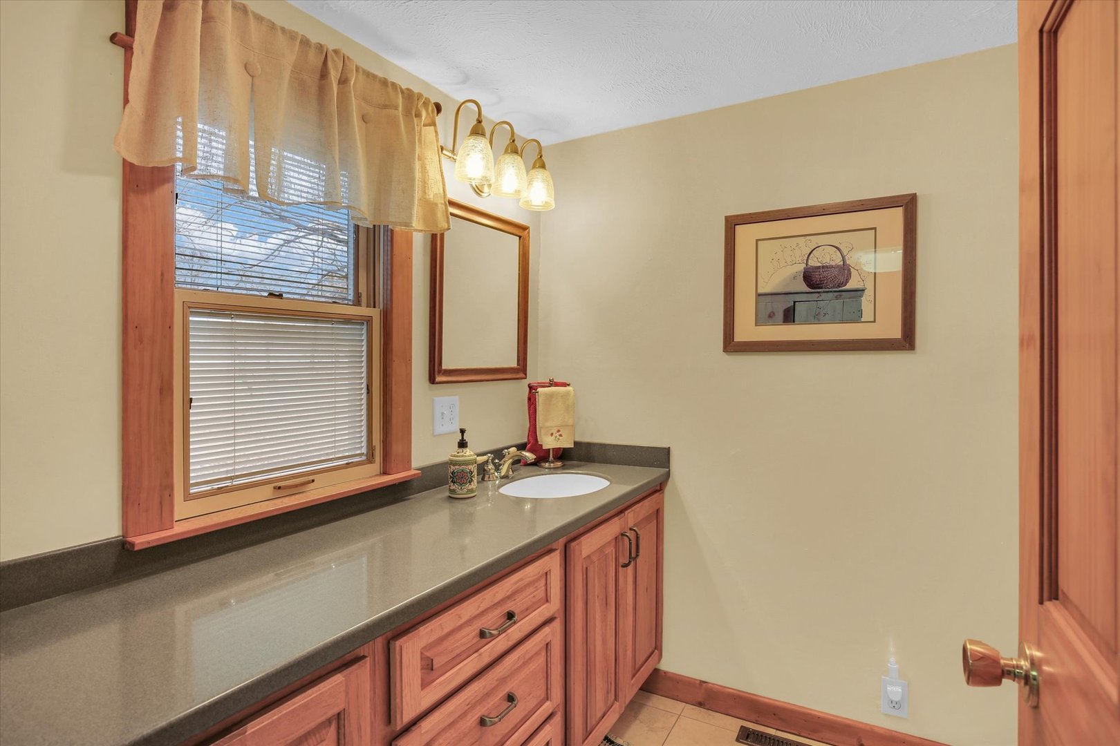 112 North Front Street Sadorus, IL 61872 - Photo 20 of 44 a bathroom with a sink a mirror and a window