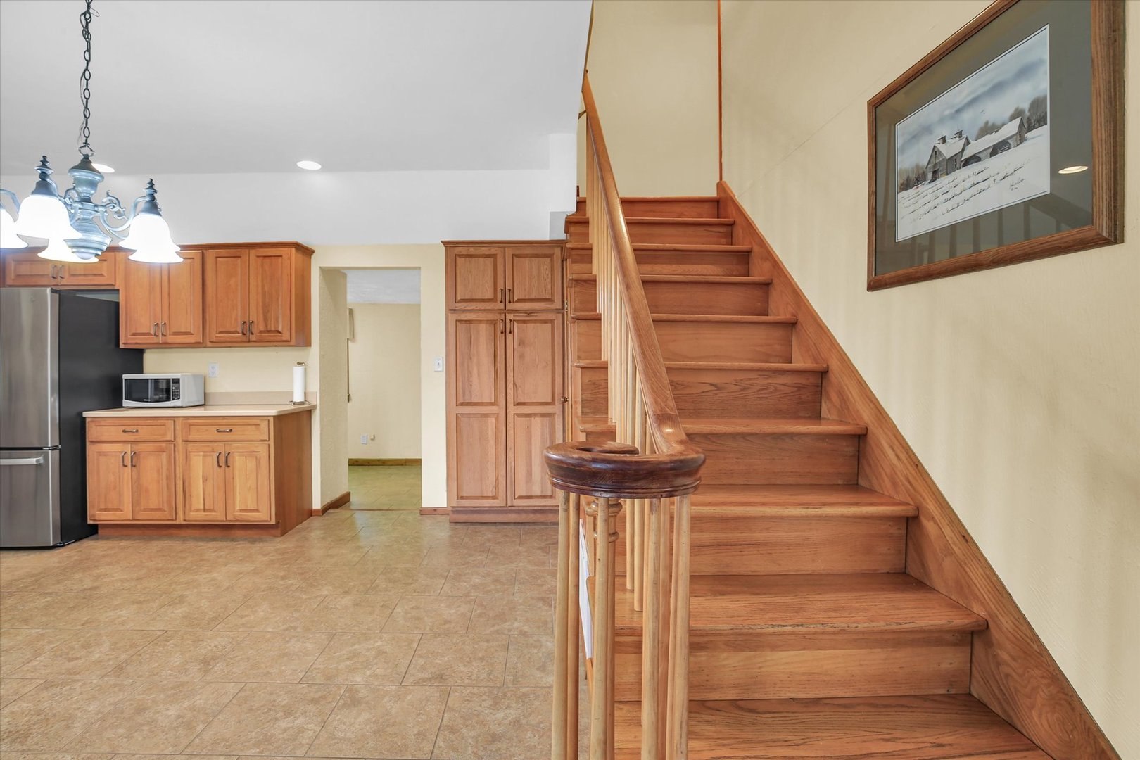 112 North Front Street Sadorus, IL 61872 - Photo 22 of 44 a view of kitchen and utility room with stairs