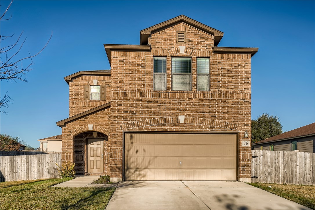 a front view of a house with parking