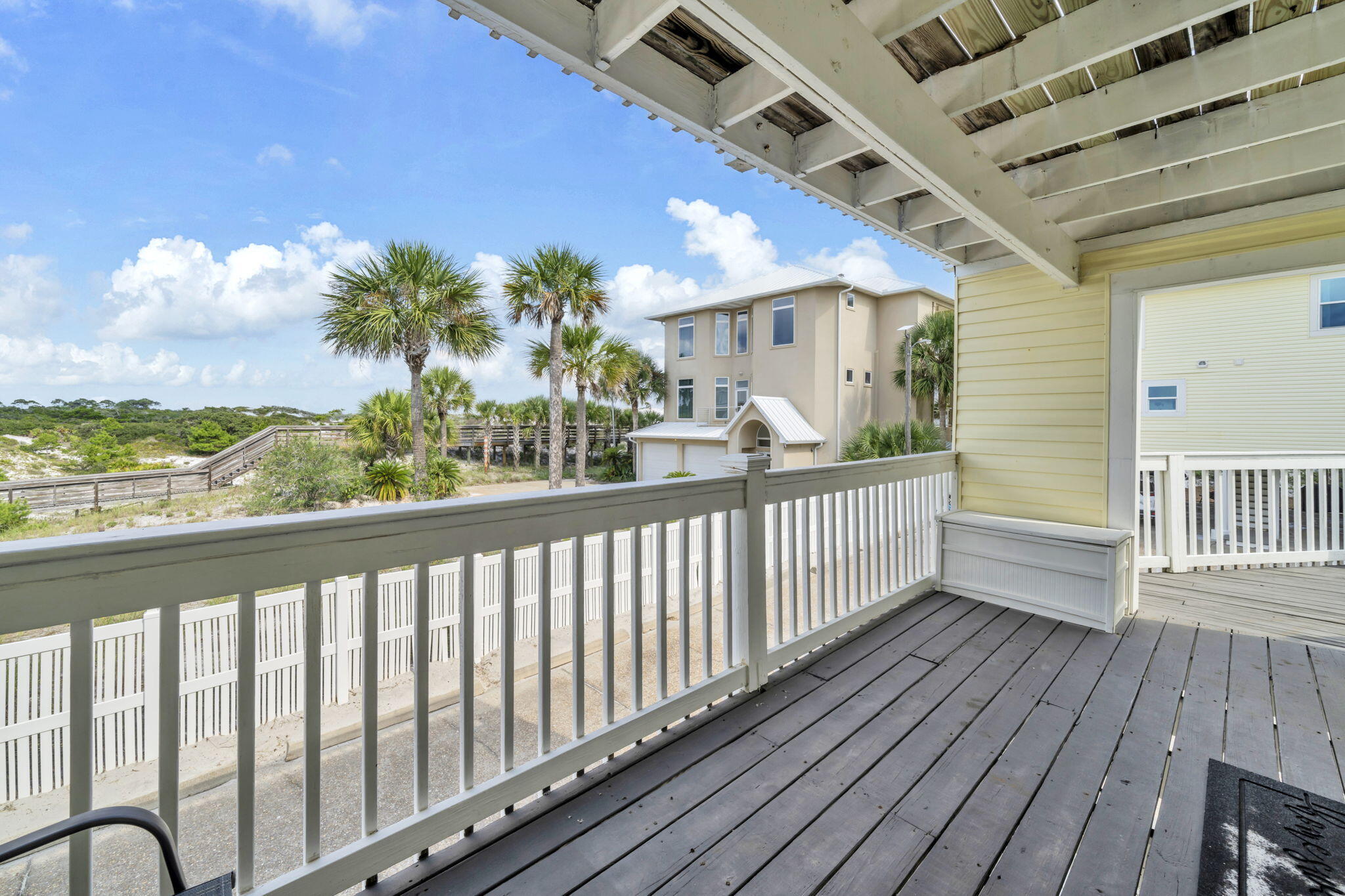 228 Walton Magnolia Lane, Unit 4 Inlet Beach, FL 32461 - Photo 13 of 45 a view of a balcony with wooden floor