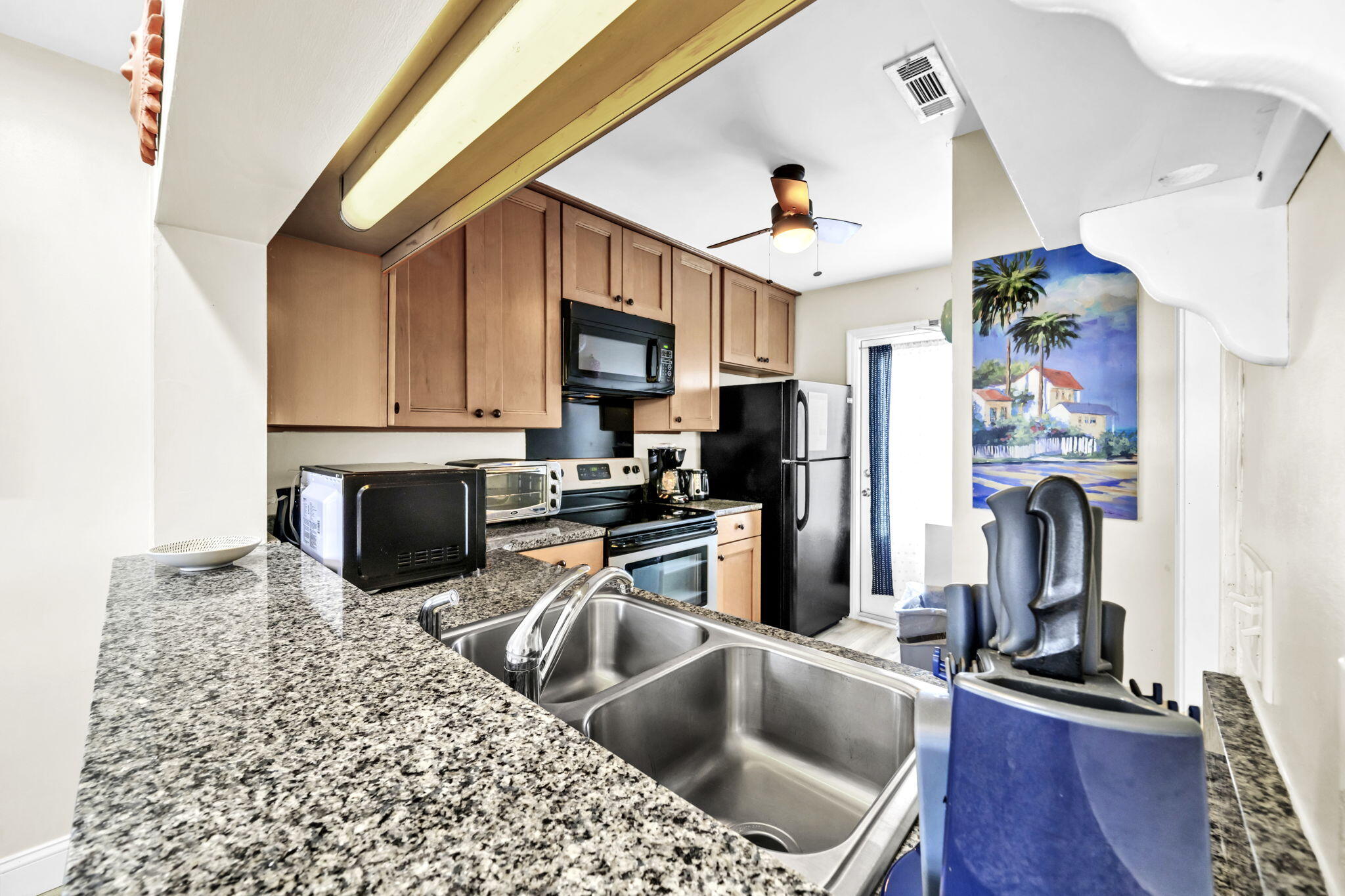 228 Walton Magnolia Lane, Unit 4 Inlet Beach, FL 32461 - Photo 20 of 45 a kitchen with a sink appliances and cabinets