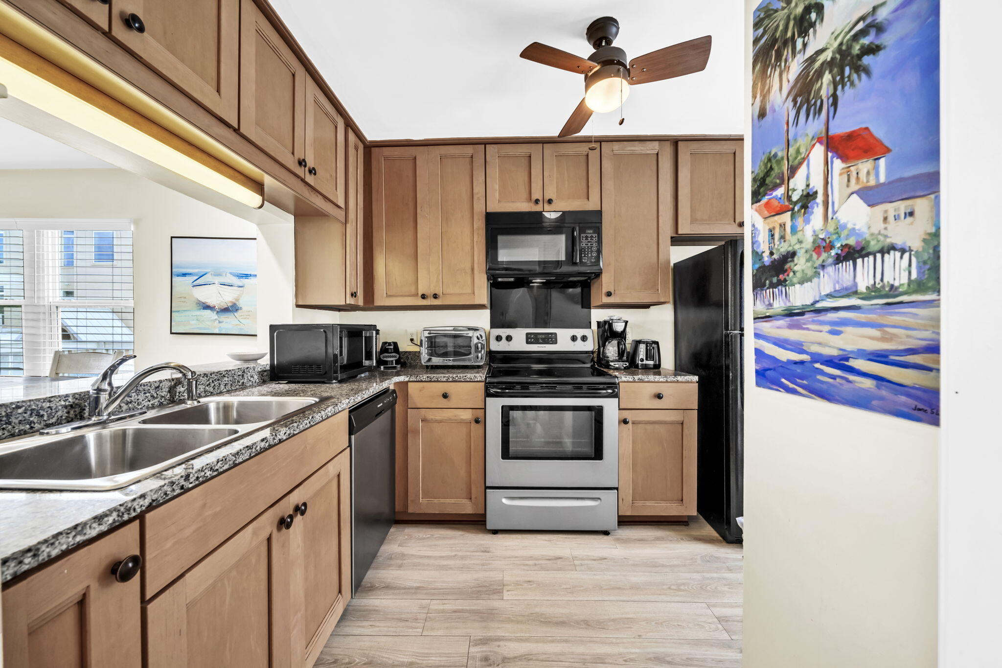 228 Walton Magnolia Lane, Unit 4 Inlet Beach, FL 32461 - Photo 21 of 45 a kitchen with stainless steel appliances granite countertop a sink and dishwasher a stove top oven with wooden floor