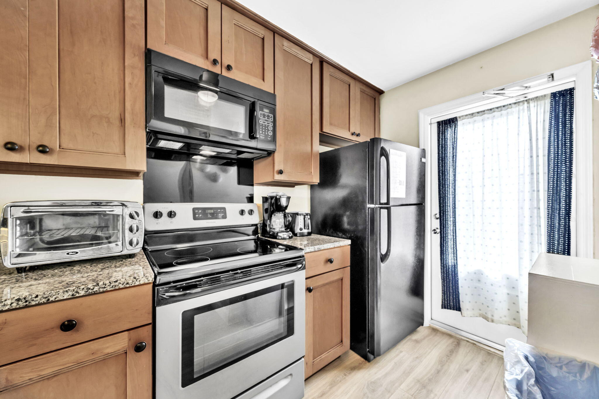 228 Walton Magnolia Lane, Unit 4 Inlet Beach, FL 32461 - Photo 22 of 45 a kitchen with stainless steel appliances granite countertop a refrigerator stove and sink