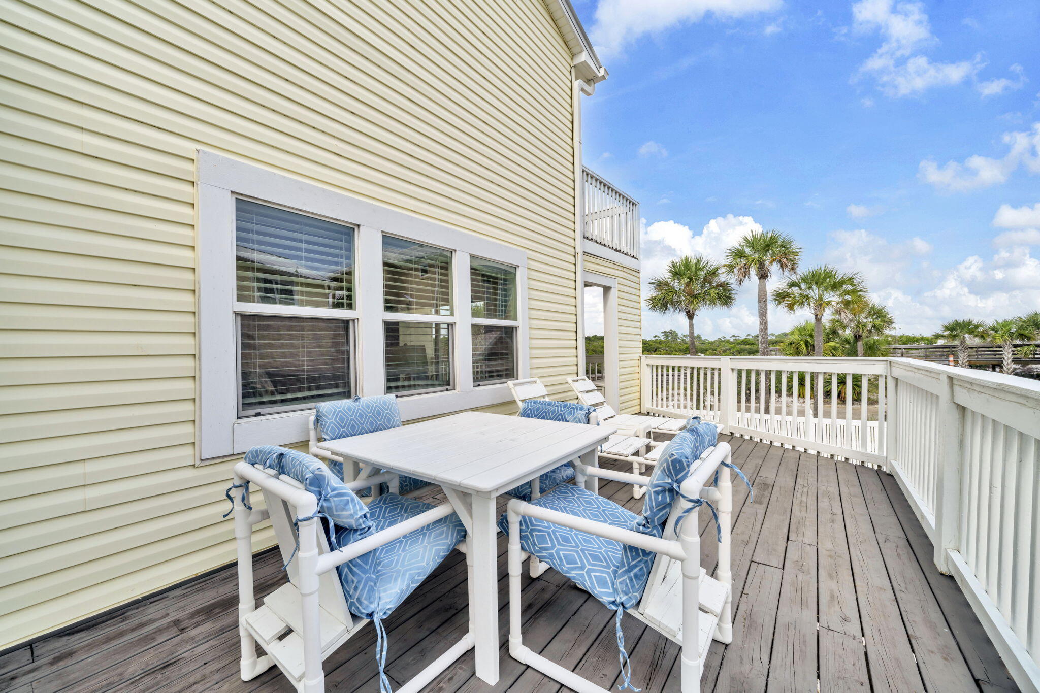228 Walton Magnolia Lane, Unit 4 Inlet Beach, FL 32461 - Photo 27 of 45 a view of a patio with a table and chairs