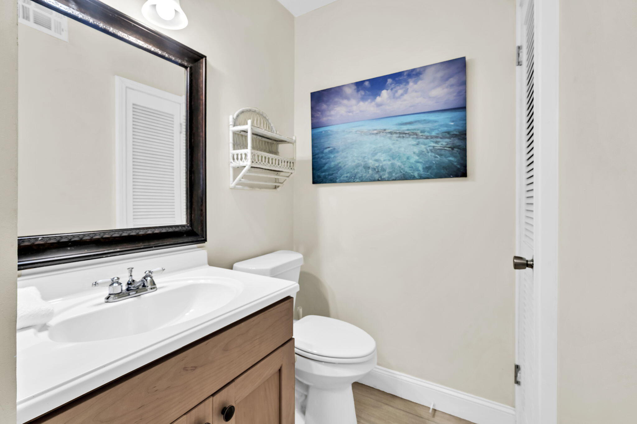 228 Walton Magnolia Lane, Unit 4 Inlet Beach, FL 32461 - Photo 30 of 45 a bathroom with a sink vanity and toilet