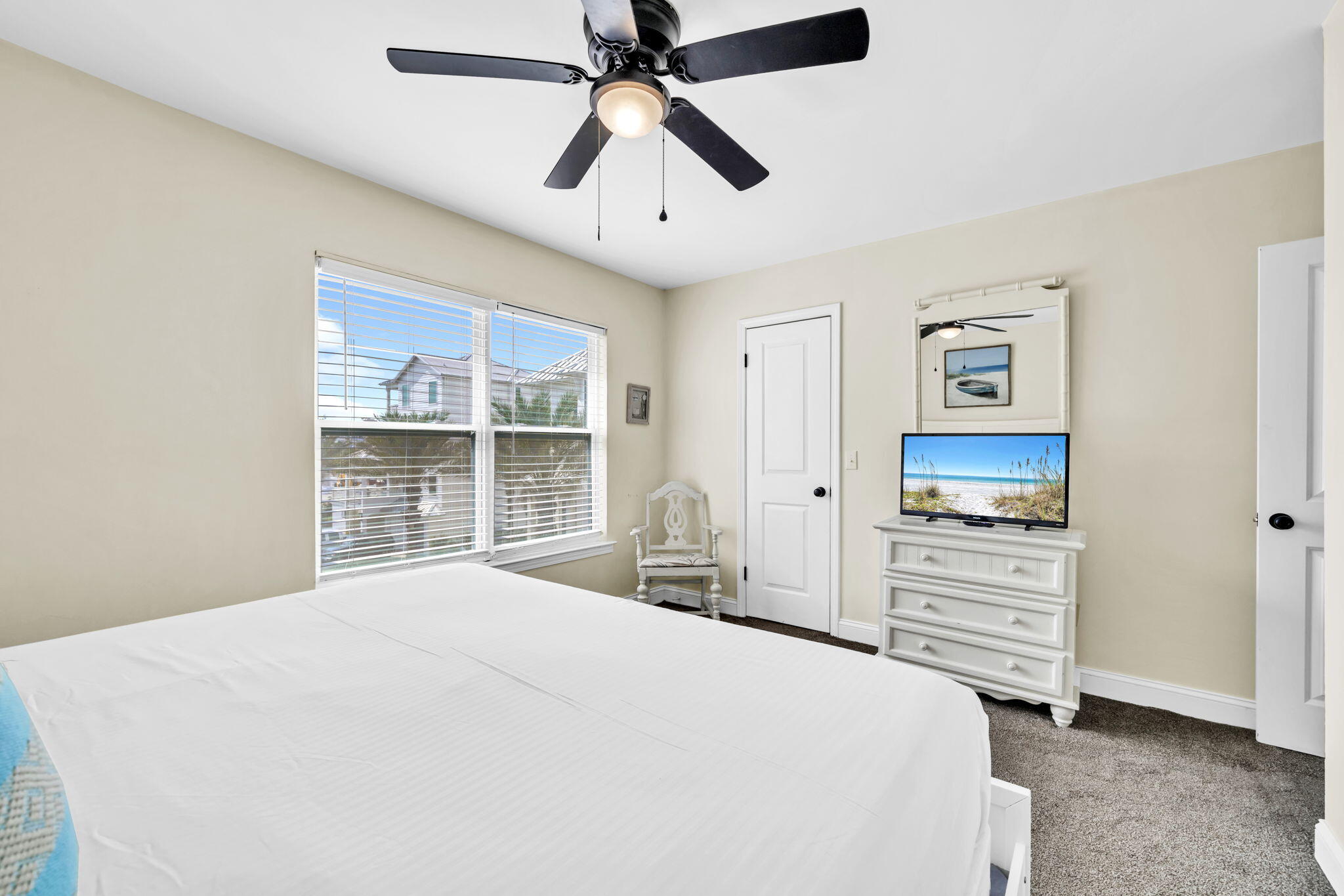 228 Walton Magnolia Lane, Unit 4 Inlet Beach, FL 32461 - Photo 32 of 45 a bedroom with a bed and a window