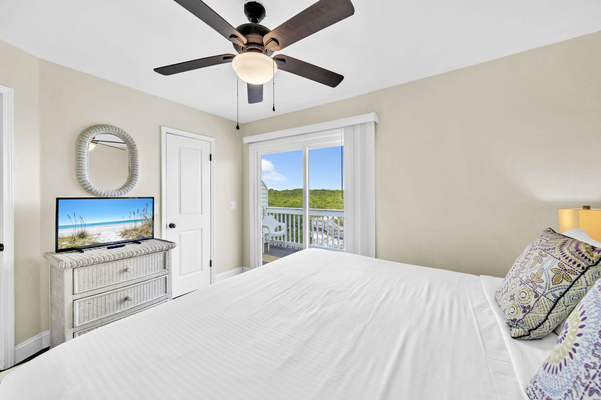 228 Walton Magnolia Lane, Unit 4 Inlet Beach, FL 32461 - Photo 34 of 45 a bedroom with a large bed and flat tv