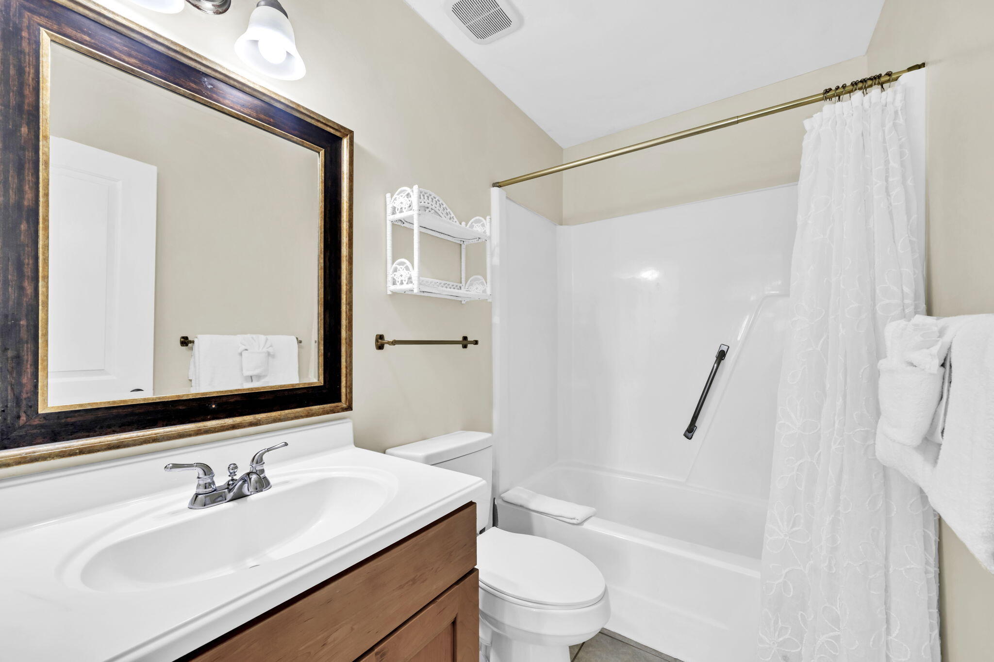 228 Walton Magnolia Lane, Unit 4 Inlet Beach, FL 32461 - Photo 35 of 45 a bathroom with a sink a toilet and shower