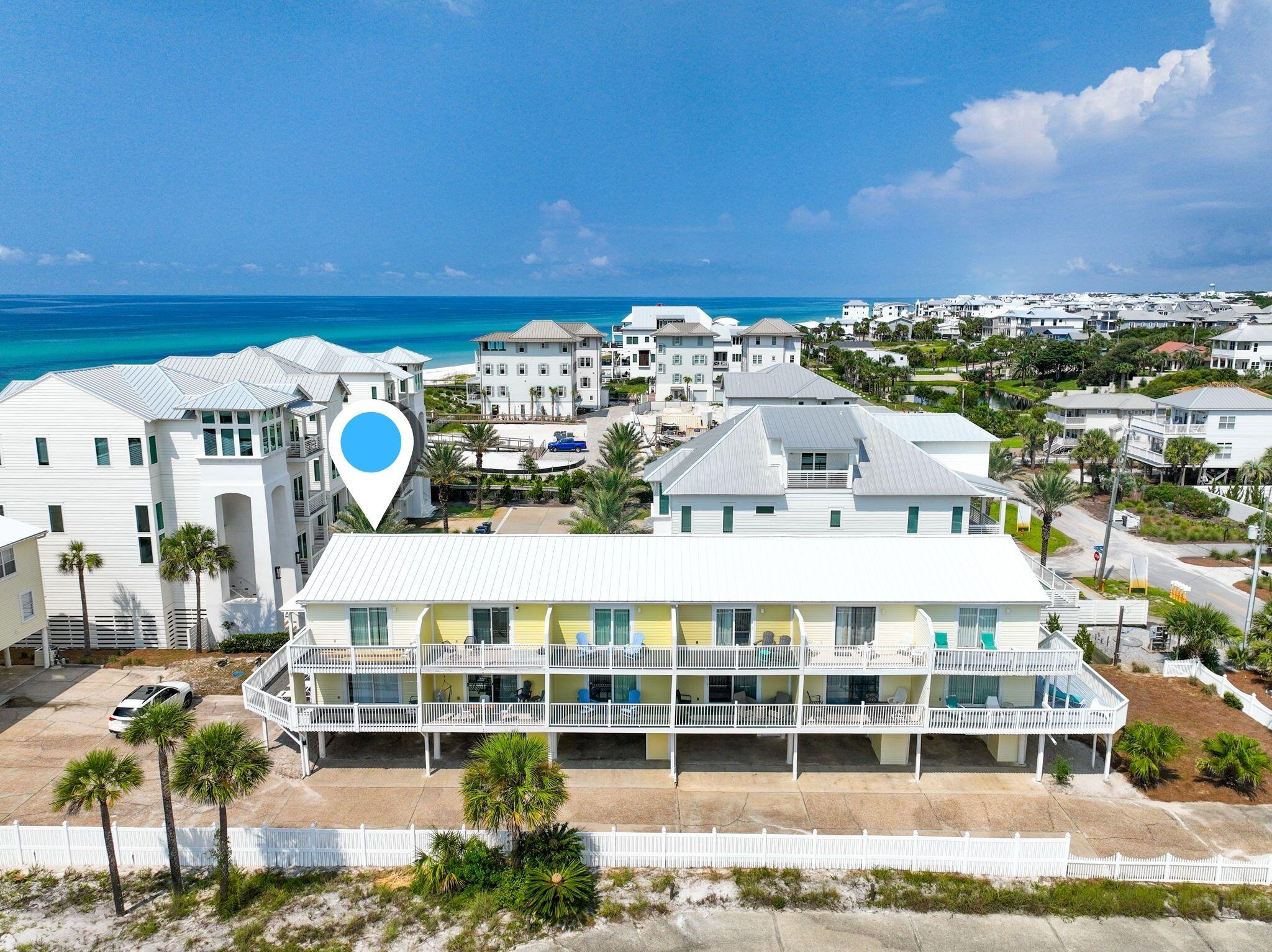228 Walton Magnolia Lane, Unit 4 Inlet Beach, FL 32461 - Photo 38 of 45 a view of a building with many windows