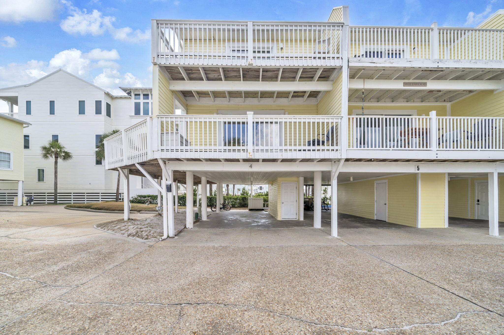 228 Walton Magnolia Lane, Unit 4 Inlet Beach, FL 32461 - Photo 9 of 45 a view of a building with a bench