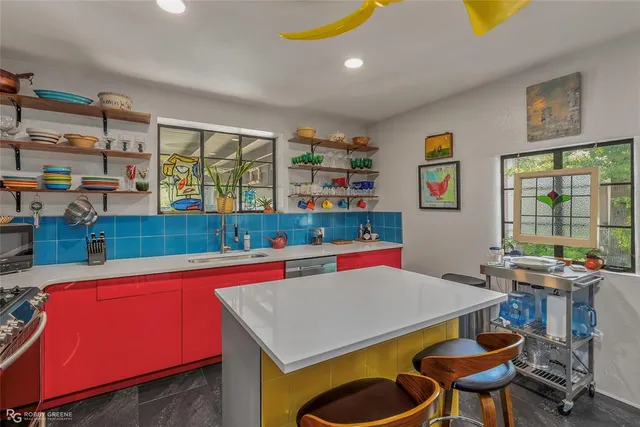 a room with furniture and large window