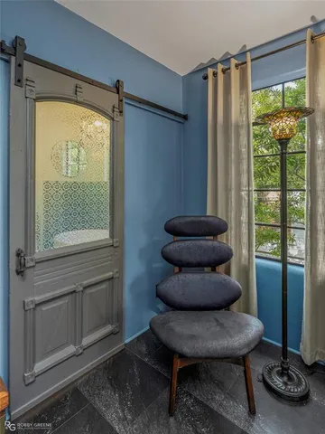 a view of livingroom with furniture and a window