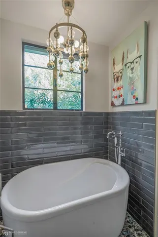 a white bath tub sitting in a bathroom