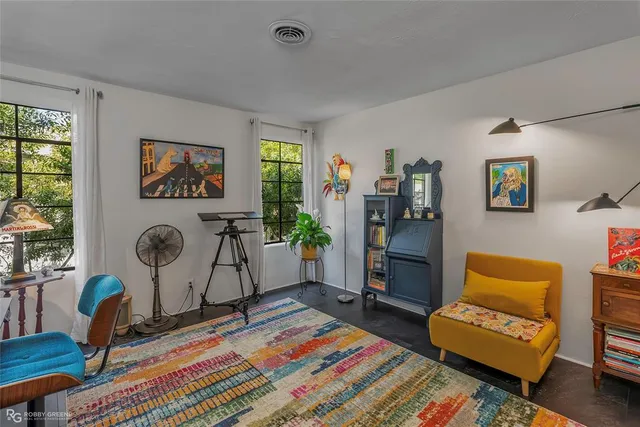 a bed room with furniture and a window