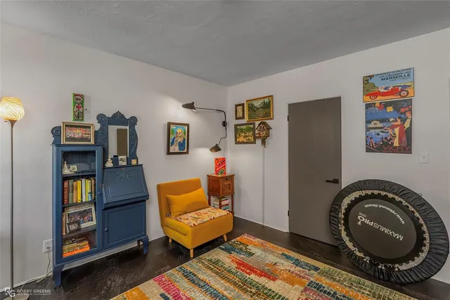 a living room with furniture and a rug