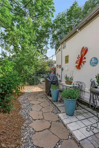 a view of a backyard with sitting area