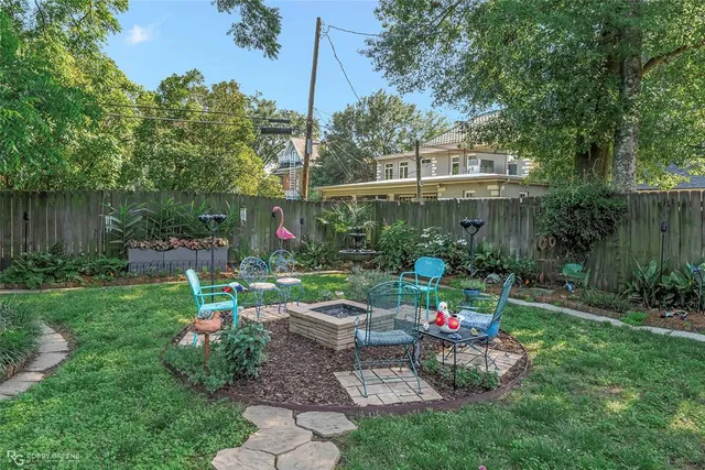 a view of a table and chairs in the garden