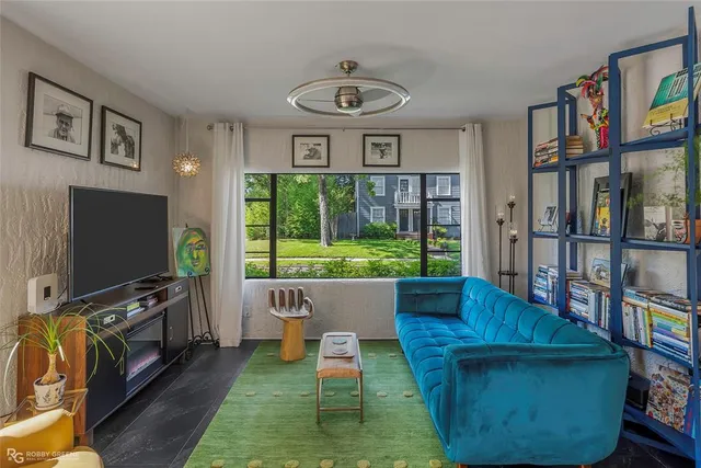 a living room with furniture and a flat screen tv