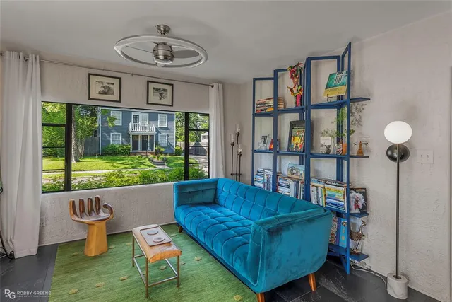 a living room with furniture and a large window