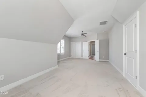 a bathroom with a granite countertop sink mirror and a bathtub