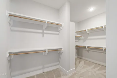 a view of swimming pool and trees in the background