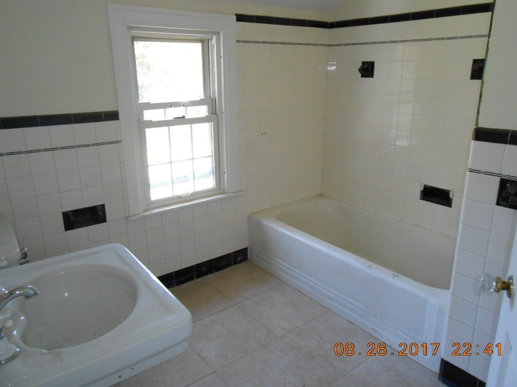 2338 Wilbraham Road Springfield, MA 01129 - Photo 13 of 17 a bathroom with a bathtub and a shower
