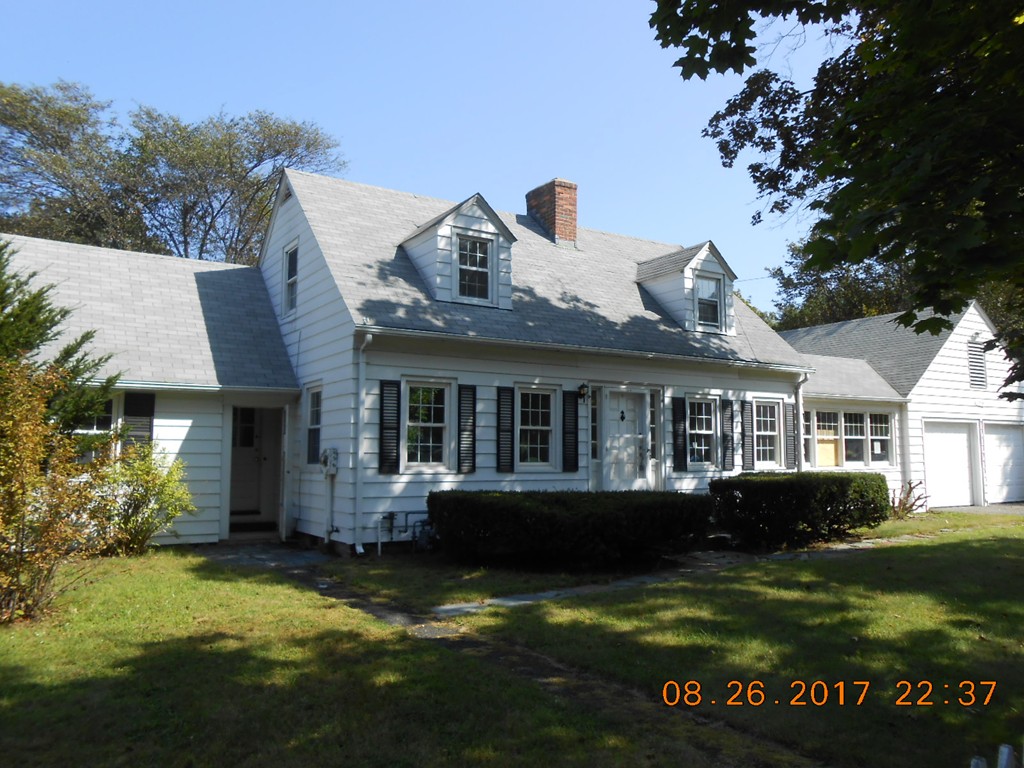 2338 Wilbraham Road Springfield, MA 01129 - Photo 3 of 17 a front view of a house with a garden and swimming pool