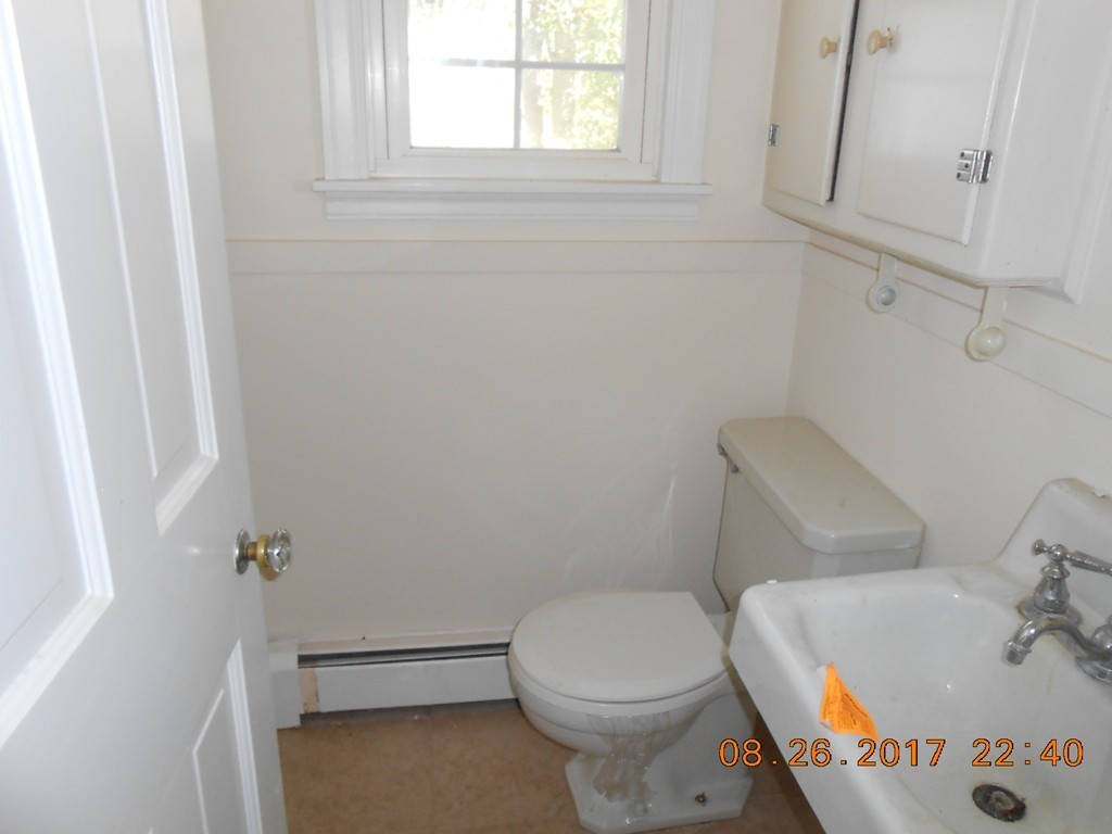2338 Wilbraham Road Springfield, MA 01129 - Photo 8 of 17 a bathroom with a sink and toilet