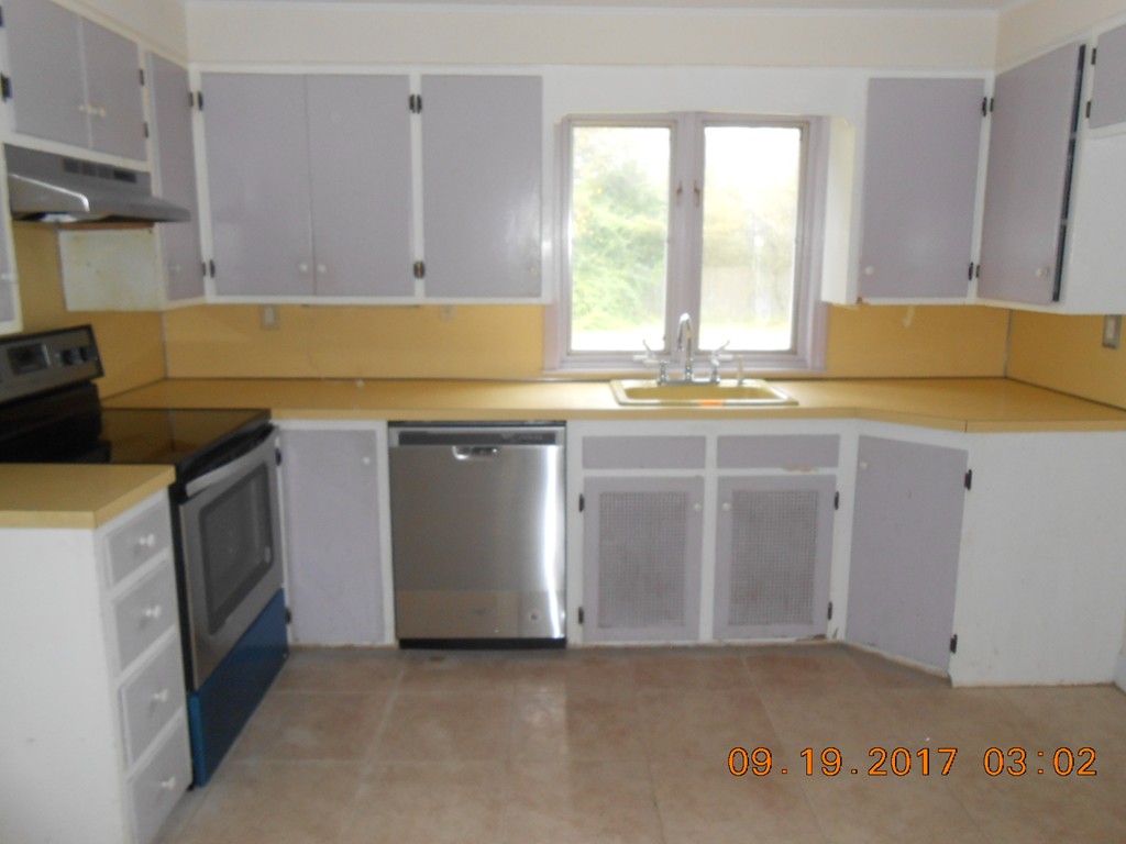 2338 Wilbraham Road Springfield, MA 01129 - Photo 9 of 17 a kitchen with a sink and a stove