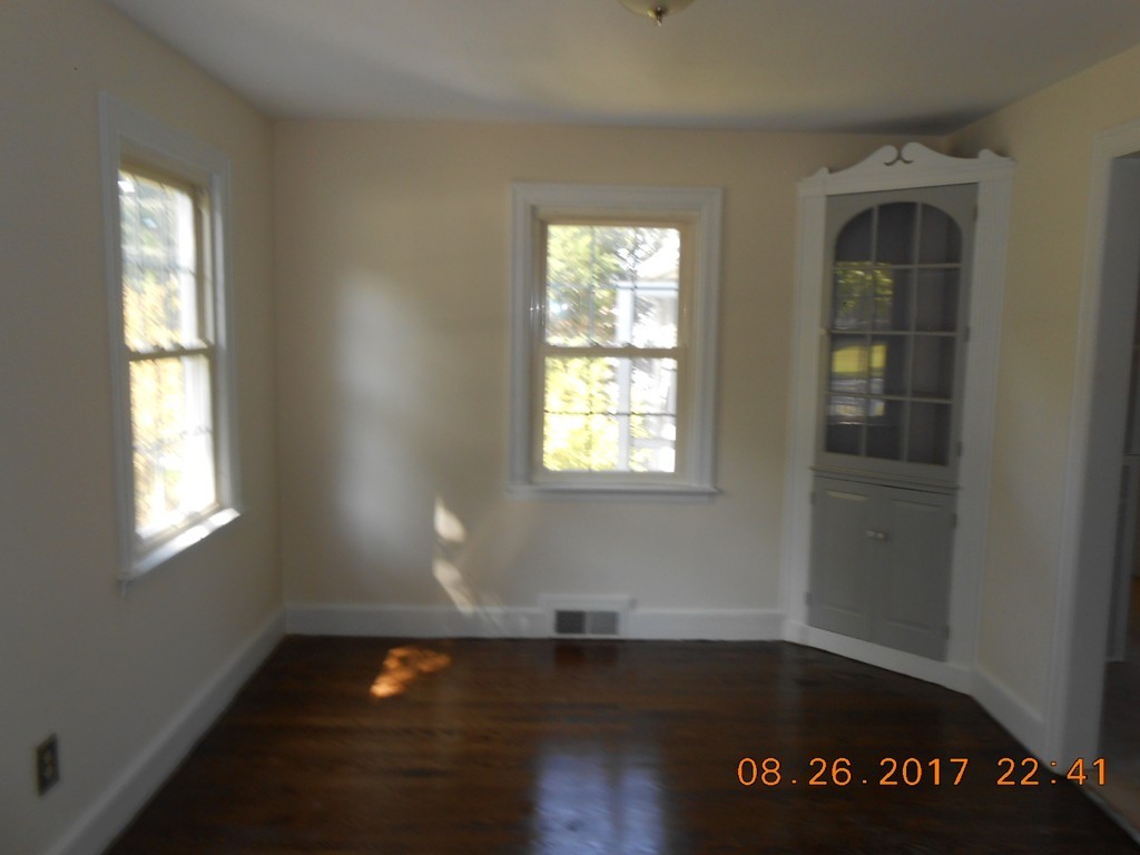2338 Wilbraham Road Springfield, MA 01129 - Photo 10 of 17 an empty room with wooden floor and windows