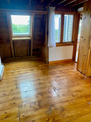 a view of outdoor space with wooden floor