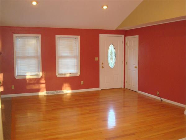 5 Claire Road Amesbury, MA 01913 - Photo 8 of 19 a view of an empty room with window and wooden floor