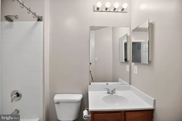 a bathroom with a double vanity sink and mirror