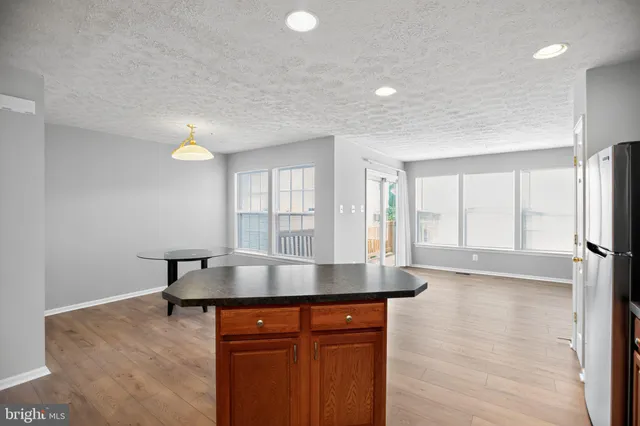 a view of a house with a porch and furniture