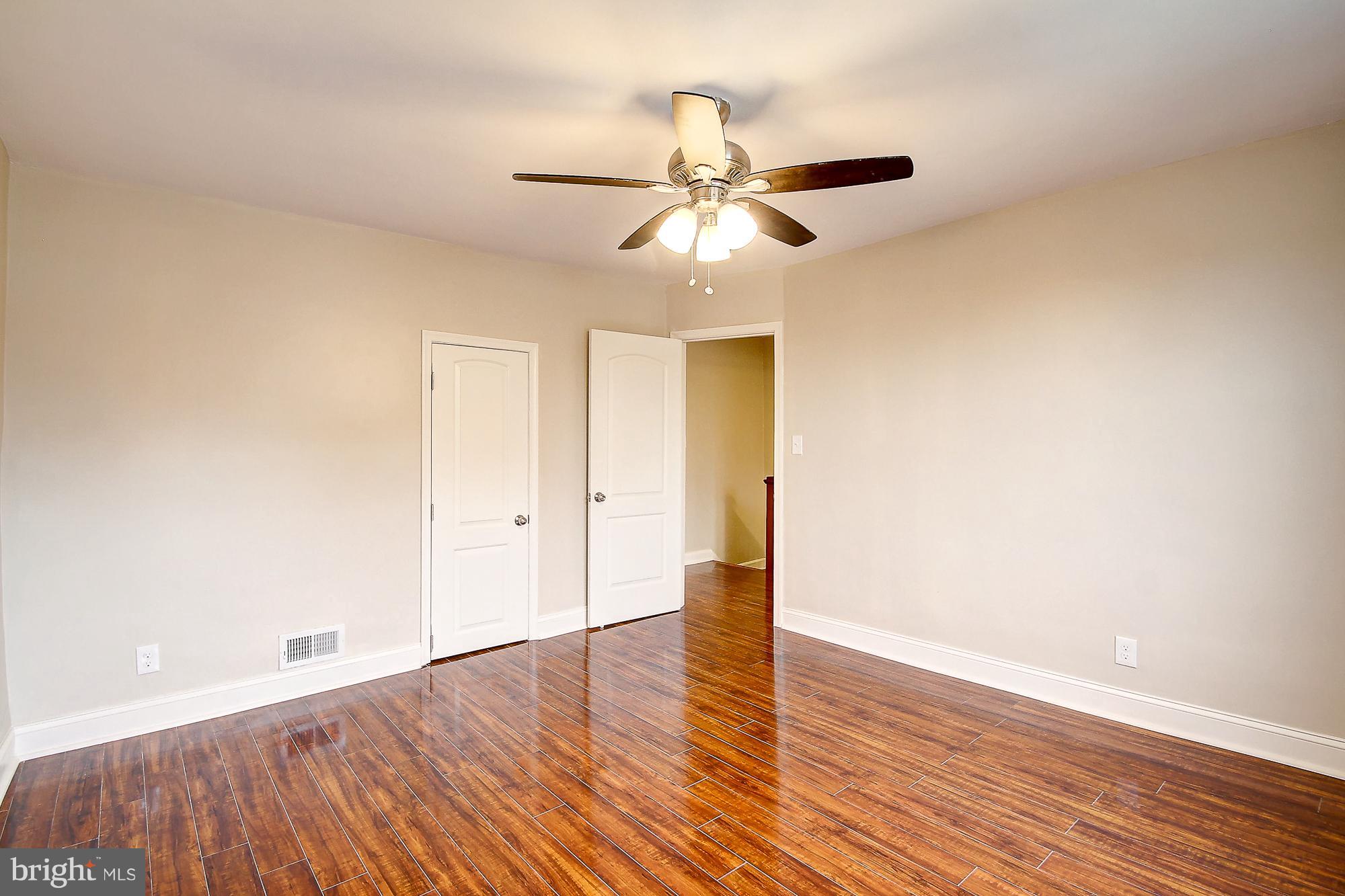 1503 East Cold Spring Lane Baltimore, MD 21218 - Photo 14 of 25 a view of an empty room with wooden floor