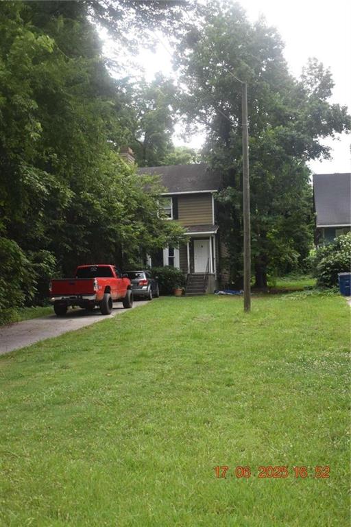 4433 Azalea Drive Macon, GA 31210 - Photo 2 of 24 a front view of a house with a garden