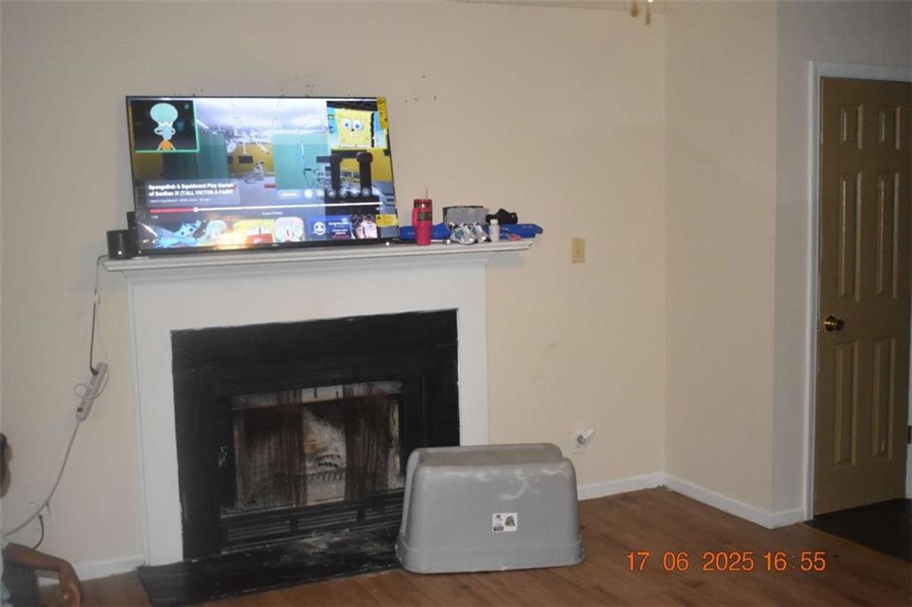 4433 Azalea Drive Macon, GA 31210 - Photo 3 of 24 a living room with furniture and a fireplace