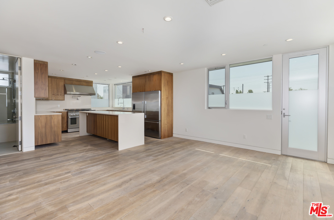 806 Brooks Avenue Venice, CA 90291 - Photo 3 of 29 a view of kitchen with stainless steel appliances granite countertop a stove top oven a refrigerator and a sink