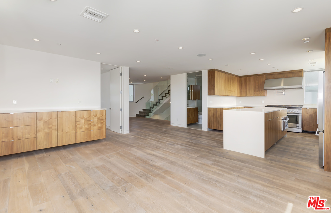 806 Brooks Avenue Venice, CA 90291 - Photo 4 of 29 a view of kitchen with stainless steel appliances a refrigerator and a microwave
