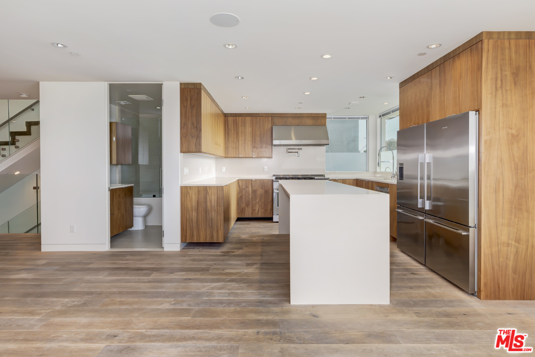 806 Brooks Avenue Venice, CA 90291 - Photo 7 of 29 a kitchen with stainless steel appliances granite countertop a refrigerator and a stove
