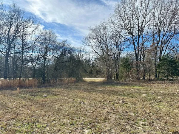 a fire hydrant in the middle of a field