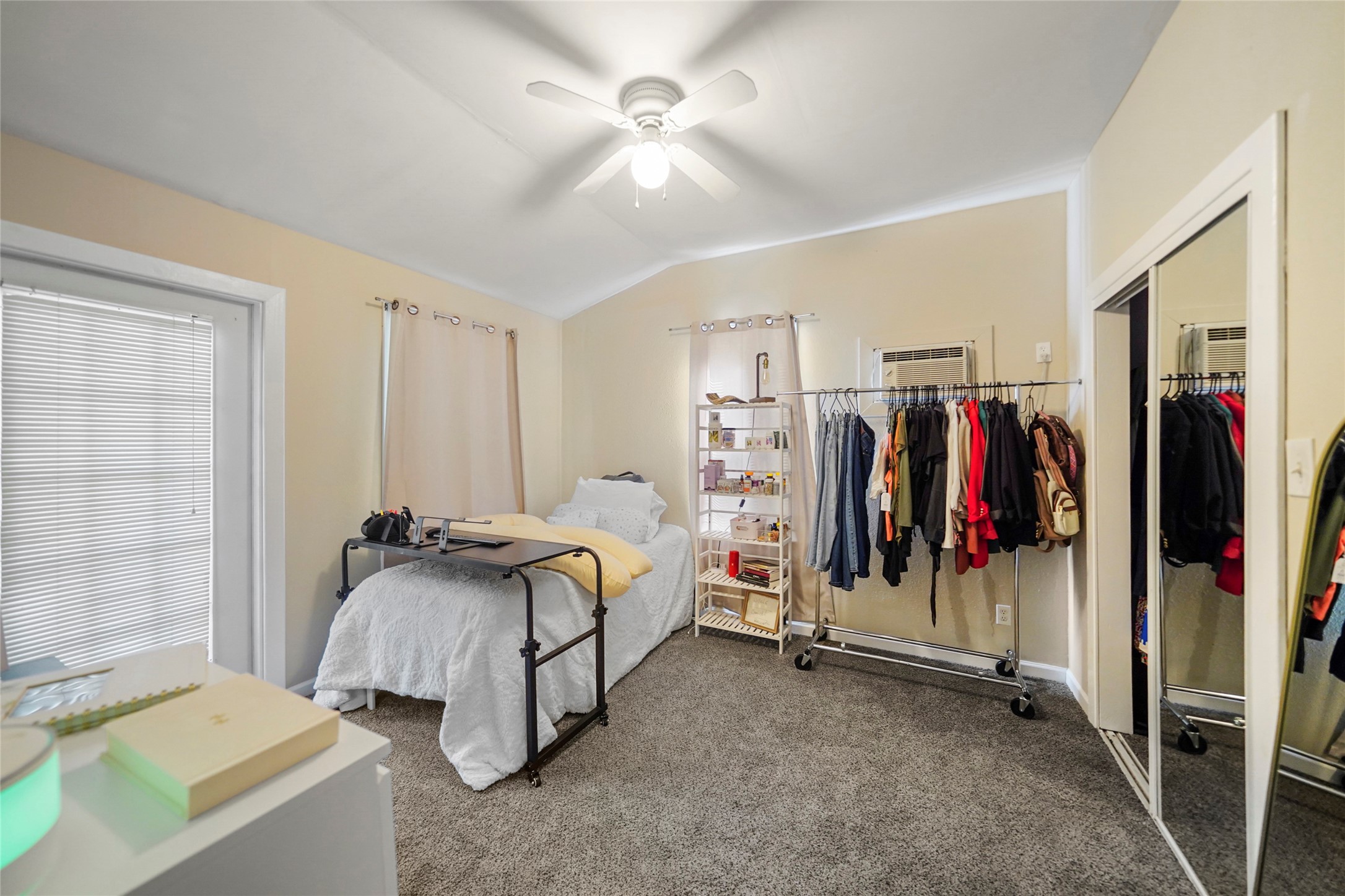 7477 Hidden Acres Drive Cleveland, TX 77328 - Photo 27 of 31 a bed room with a bed and a couch