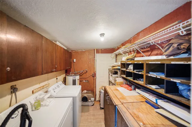 an aerial view of a house with a yard and trees