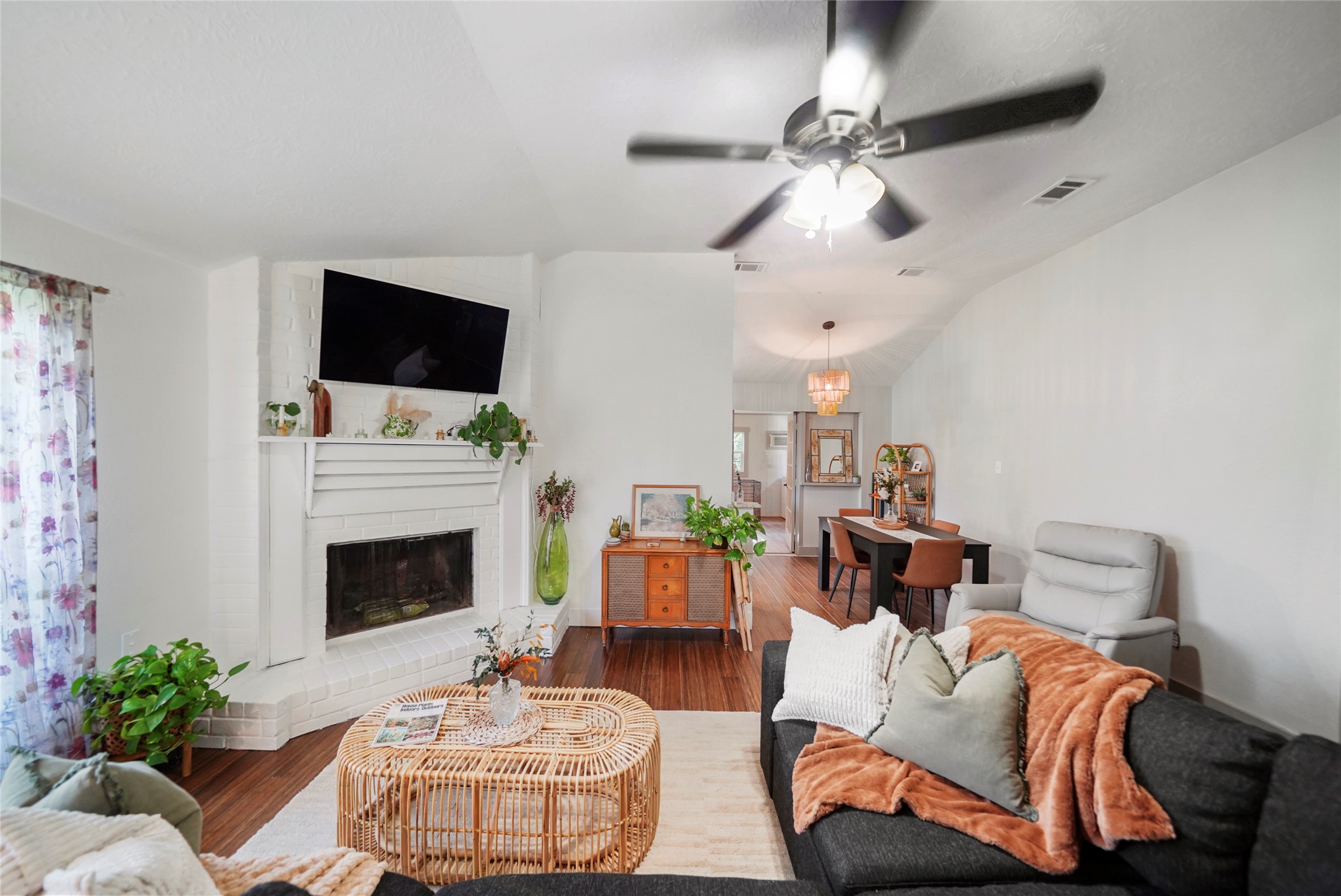 7477 Hidden Acres Drive Cleveland, TX 77328 - Photo 9 of 31 a living room with furniture a fireplace and a flat screen tv